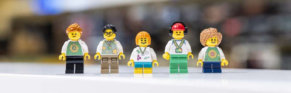 Image of Lego people wearing Hidden Disability Sunflower lanyards
