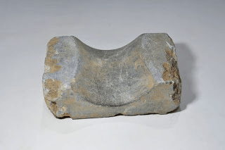a carved stone pillow from ancient Egypt 