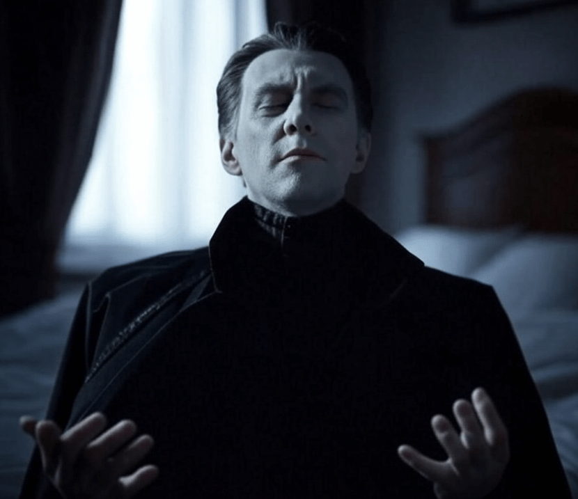 a picture of a vampire meditating in a dark bedroom