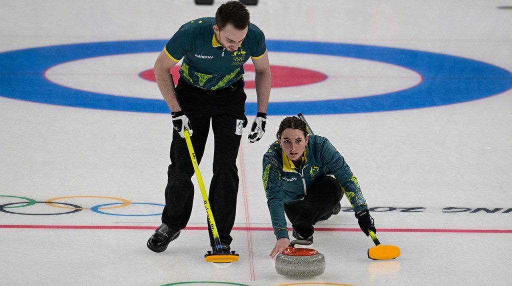 a picture of people ice-curling